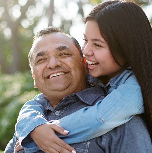 Photo of older man and his adult daughter. Photo of older man and his adult daughter.